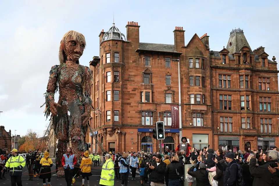 A giant puppet of a sea goddess made entirely of recycled materials walked through Glasgow during the COP26 climate change summit.